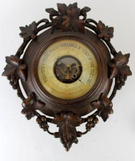 Appraisal: French Black Forest barometer French Black Forest wall mount barometer