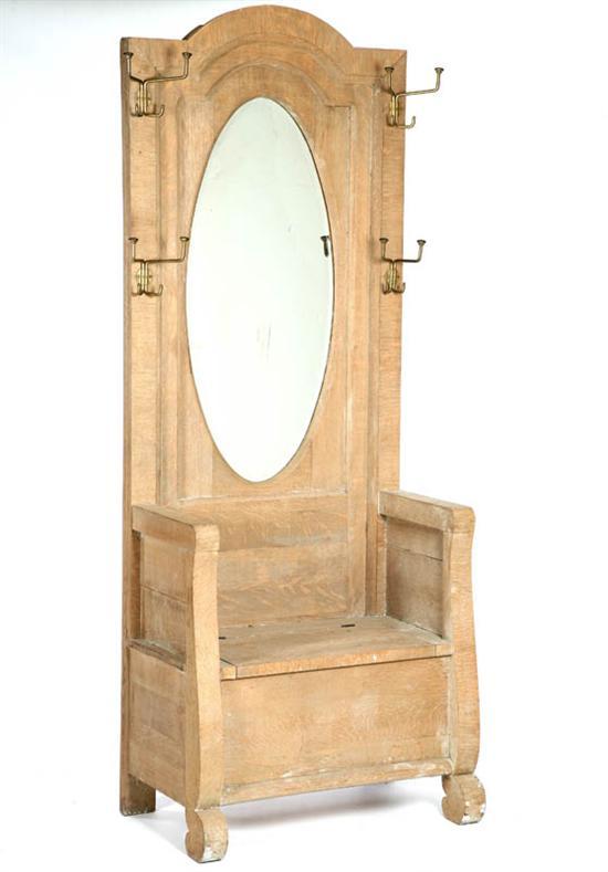 Appraisal: HALL TREE Oak with an arched top molded mirror lift