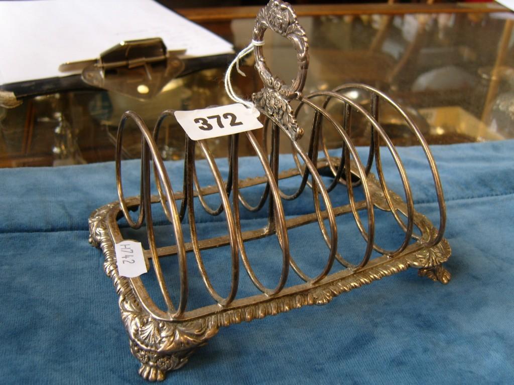 Appraisal: A Georgian silver -divisional toast rack with gadroon border and