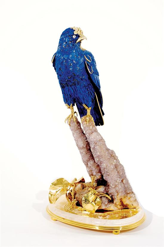 Appraisal: Diamond set carved lapis lazuli falcon sculpture pave-set diamond crest