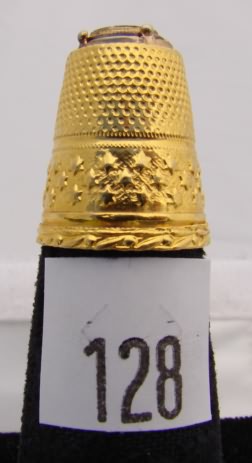 Appraisal: Gold tone with black stone gold carved tip thimble