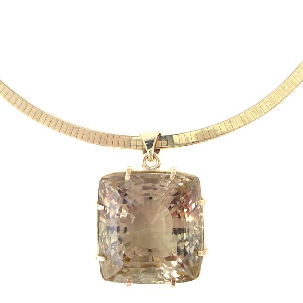 Appraisal: A large square-cut citrine and gold pendant with k omega