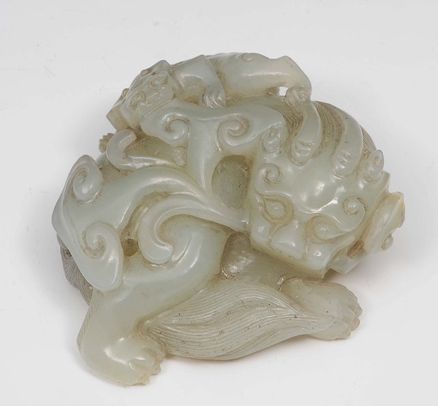 Appraisal: A Chinese white jade carving of a horned beast th