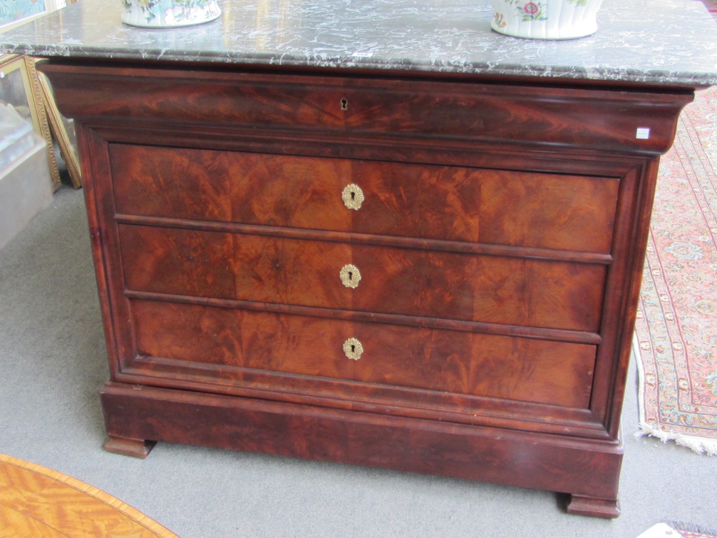 Appraisal: A th century French mahogany commode the marble top over