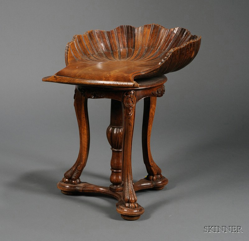 Appraisal: Italian Carved Walnut Grotto Stool with shell-form seat on swiveling