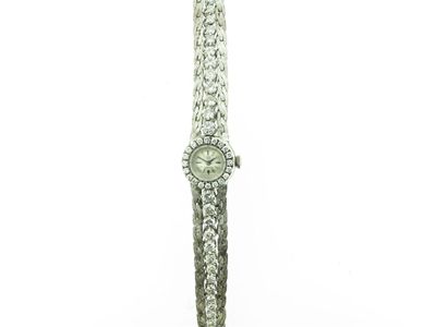 Appraisal: A ladies diamond set white gold wristwatch The small circular