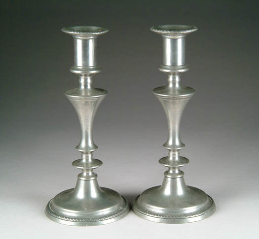 Appraisal: PAIR OF ANTIQUE PEWTER PUSH UP CANDLESTICKS th Century Round