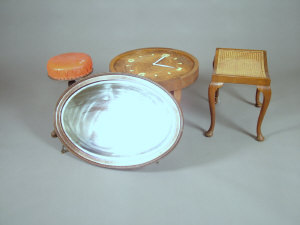 Appraisal: An Art Deco figured walnut circular occasional table with clock