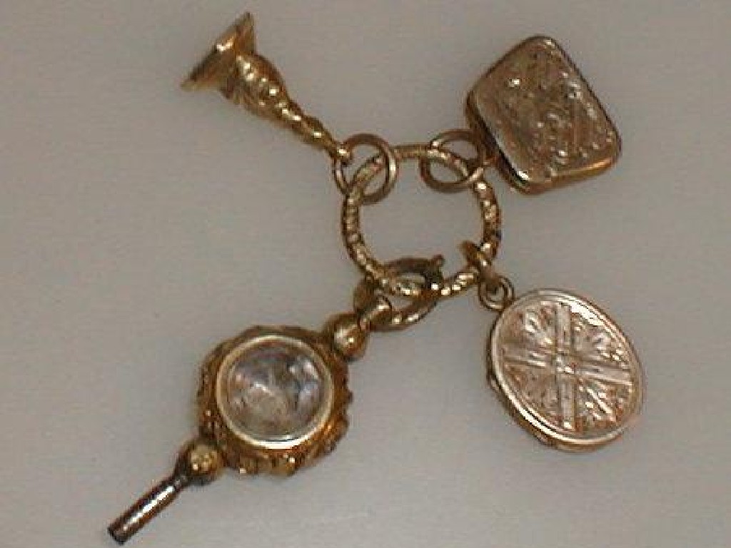 Appraisal: A watch key with smoky quartz window a small yellow