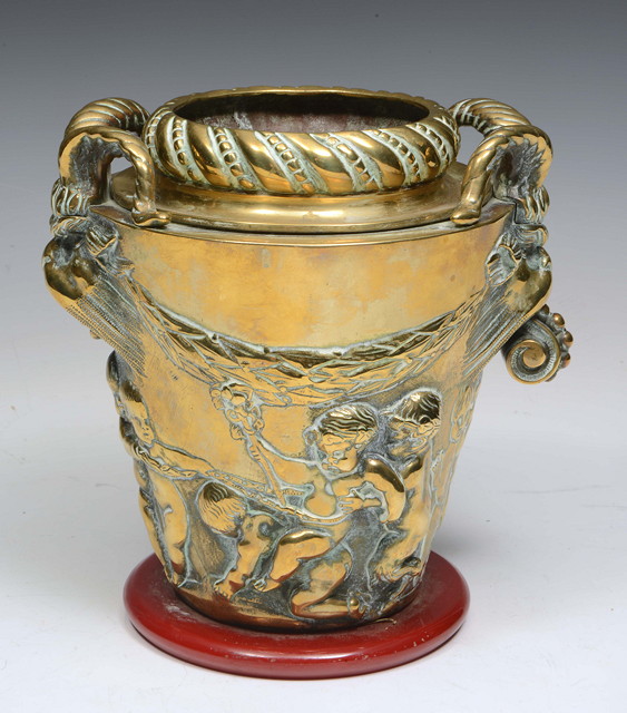 Appraisal: A 'S EMBOSSED BRASS WINE COOLER with non symmetrical scroll