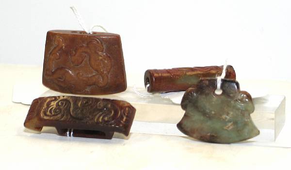 Appraisal: Four archaistic nephrite carvings The first a brown and russet