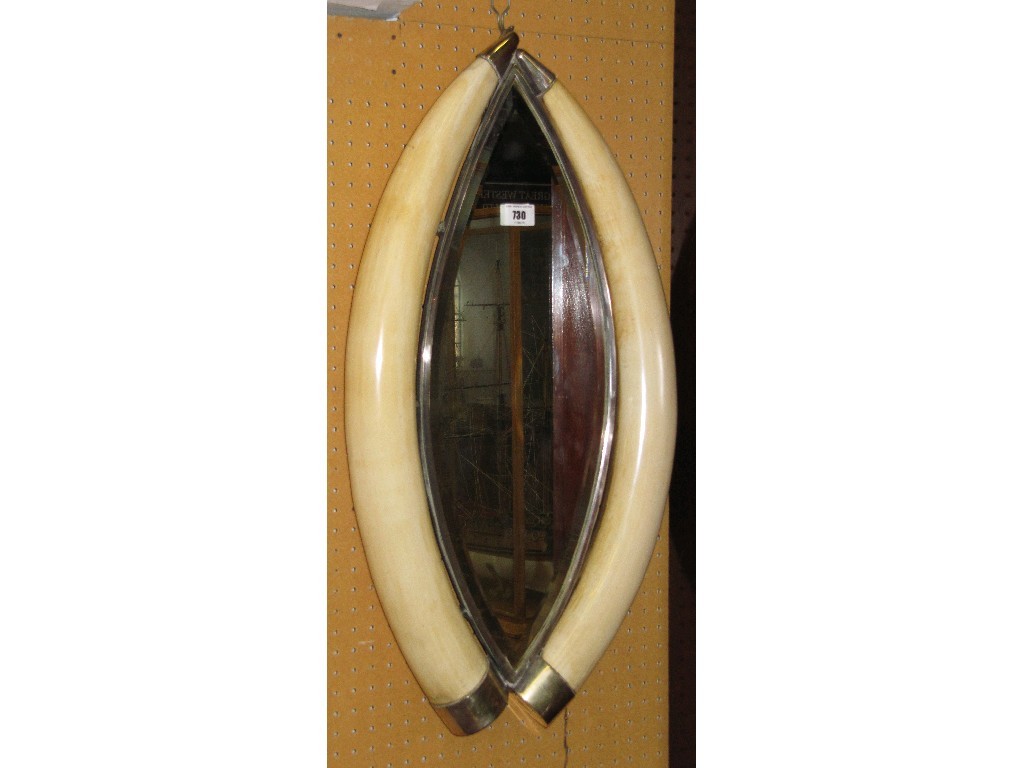 Appraisal: Elephant tusk and white metal mounted wall mirror