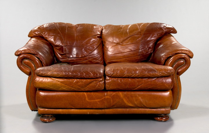 Appraisal: Distressed Brown Leather Overstuffed Love Seat with two seat cushions