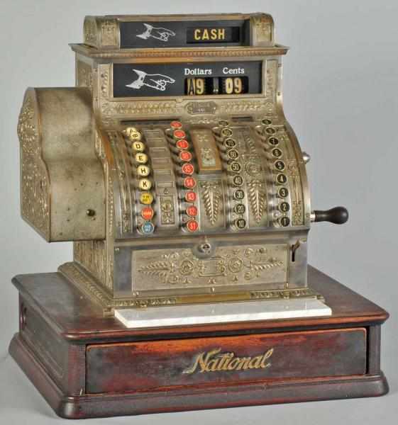 Appraisal: National Cash Register on Wooden Base Description Working Condition Excellent