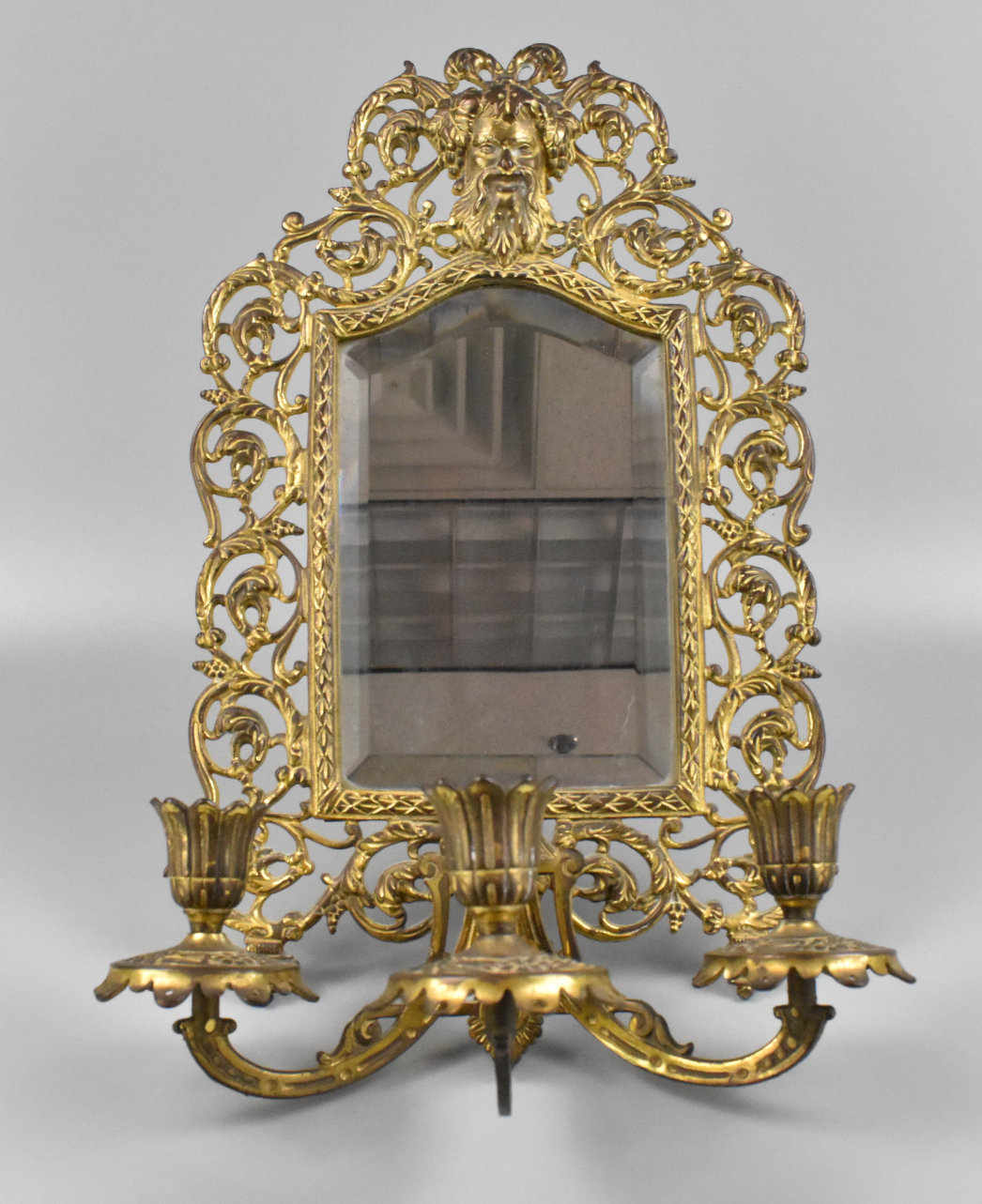 Appraisal: A Bradley Hubbard wall mirror and candelabra A beveled mirror