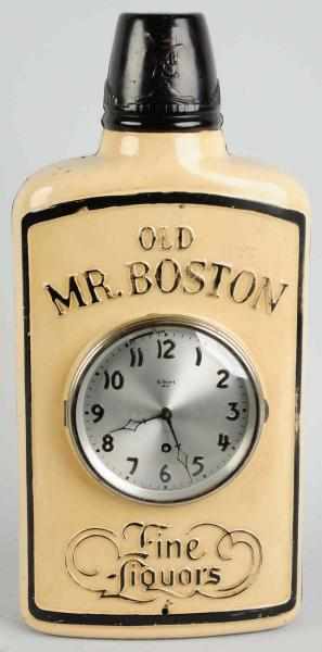 Appraisal: Old Mr Boston Embossed Tin Bottle Clock Display Circa s