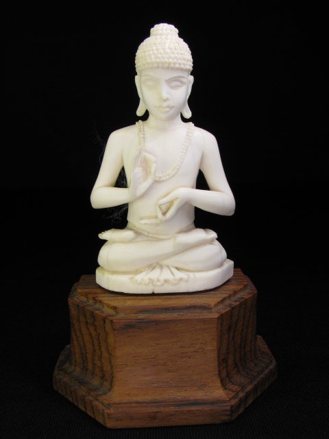 Appraisal: Carved ivory Buddha on wooden stand Ivory measures high by