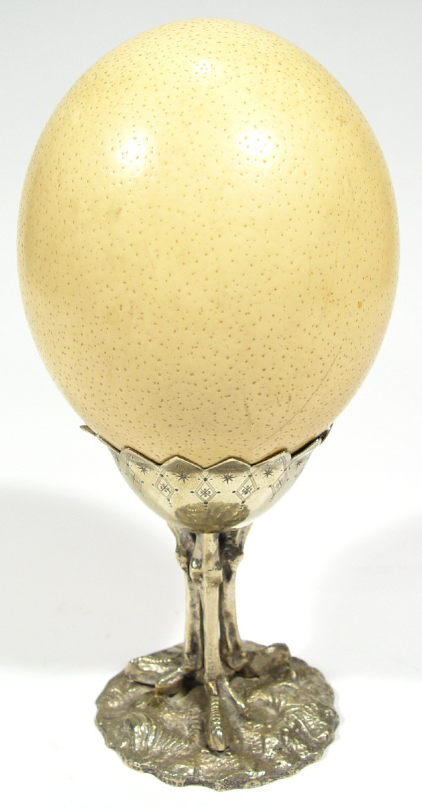 Appraisal: Ostrich egg supported on a silver plated three legged stand