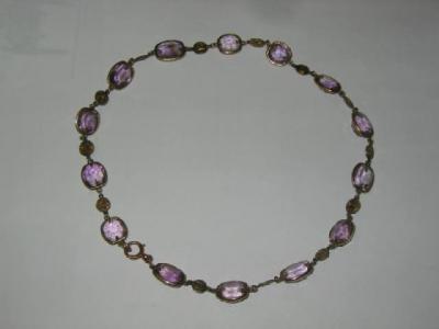 Appraisal: AN AMETHYST NECKLACE comprising fourteen cushion shaped pale amethysts in