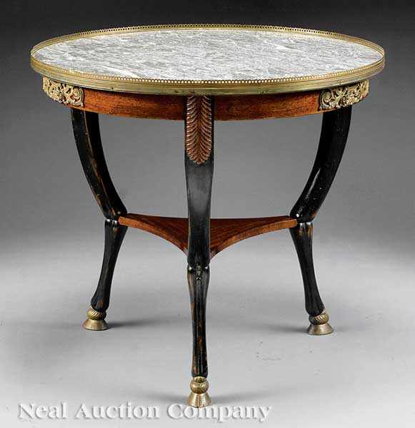 Appraisal: A French Bronze-Mounted Mahogany and Ebonized Gu ridon reticulated brass