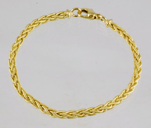 Appraisal: Bracelet in braided mesh marked K long Lobster claw clasp