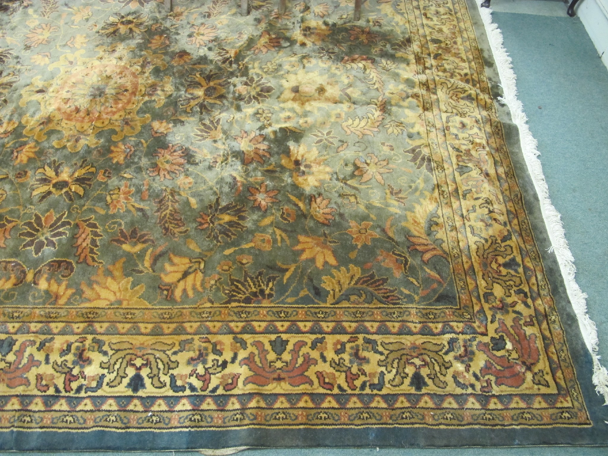 Appraisal: A large floral rug on a blue and cream ground