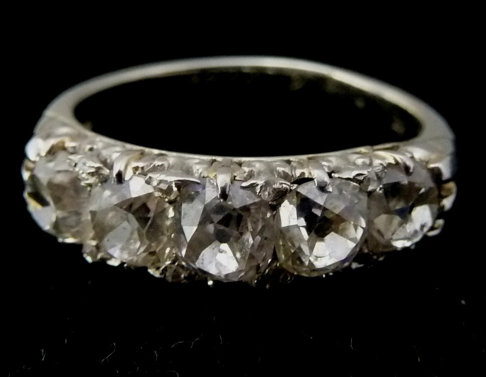 Appraisal: A Victorian diamond five-stone ring in a scroll setting the