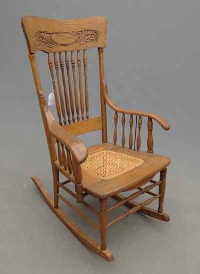 Appraisal: Victorian oak rocking chair with cane seat '' Seat Ht