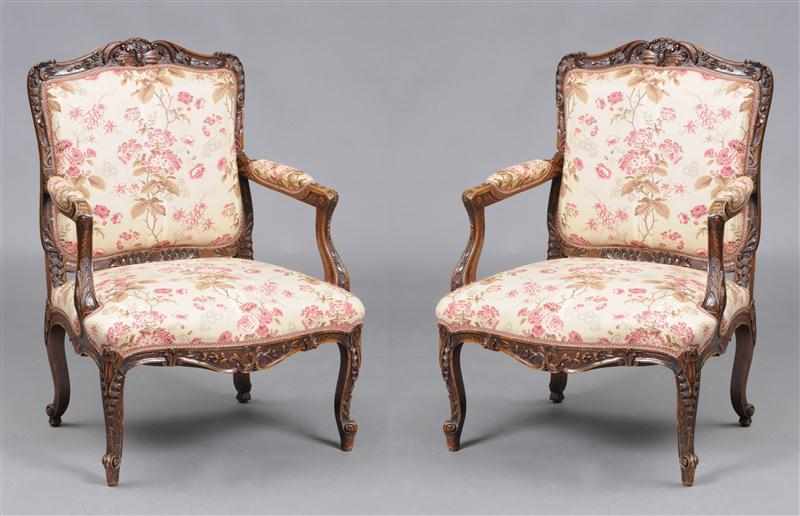 Appraisal: PAIR OF LOUIS XV STYLE CARVED WALNUT FAUTEUILS LA REINE