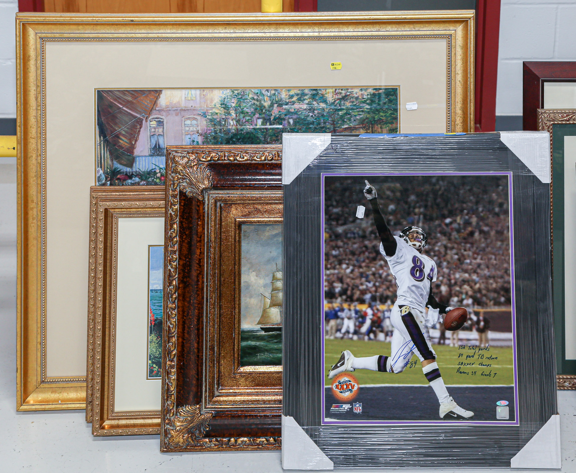 Appraisal: FOUR FRAMED WALL DECORATIONS Including a framed Jermaine Lewis autographed