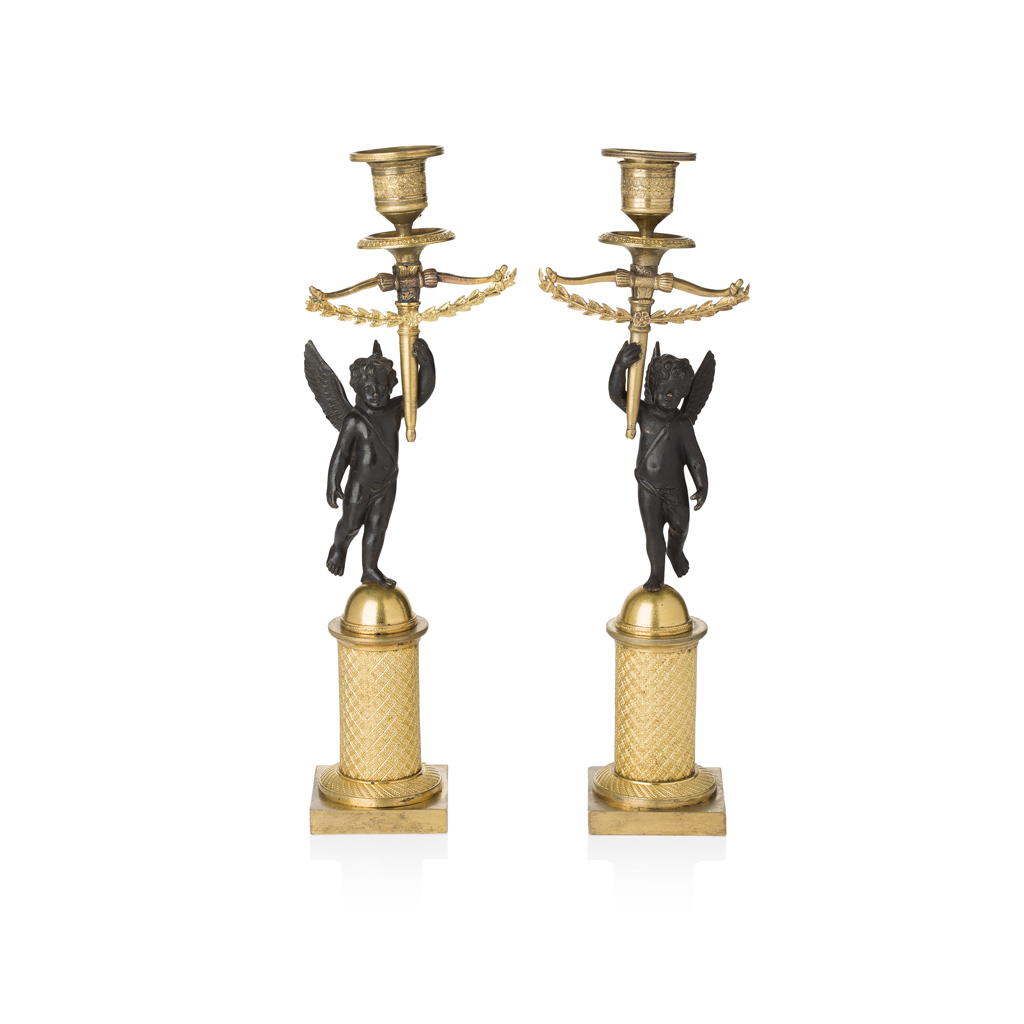 Appraisal: PAIR OF FRENCH EMPIRE GILT AND PATINATED BRONZE FIGURAL CANDLESTICKS