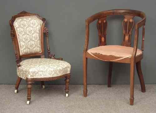 Appraisal: An Edwardian mahogany tub shaped armchair with triple vase shaped