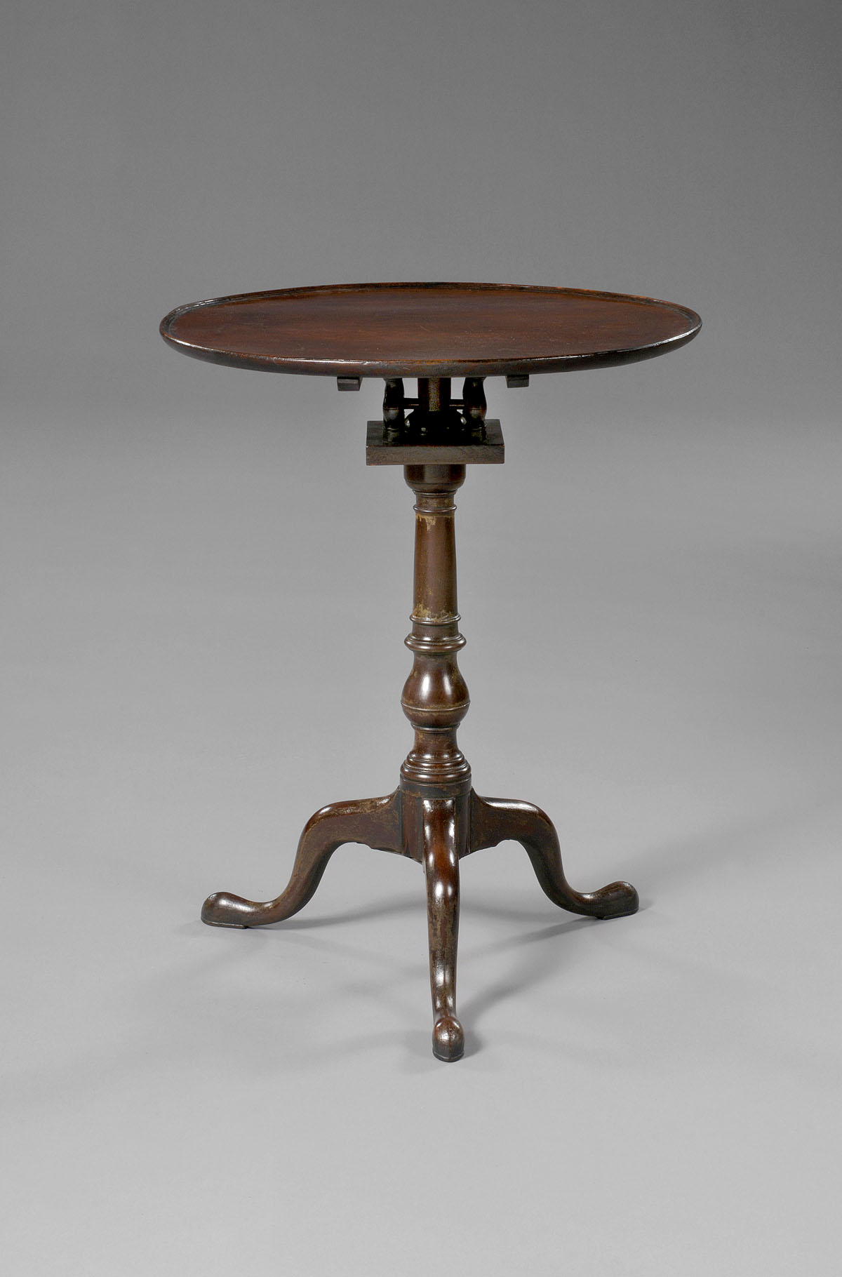 Appraisal: PENNSYLVANIA CHIPPENDALE MAHOGANY TILT- TOP CANDLESTAND The circular dish top