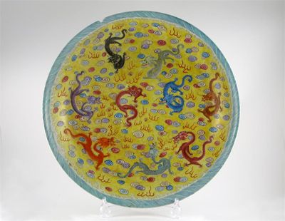 Appraisal: A massive Chinese famille rose yellow ground dish painted with