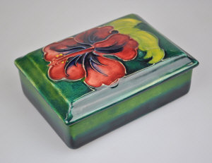 Appraisal: A Moorcroft rectangular box and cover green ground decorated with