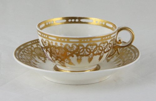 Appraisal: A Spode armorial tea cup and saucer painted trailing scrolls