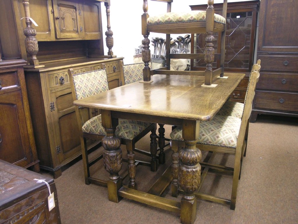 Appraisal: An oak dining suite consisting of refectory-type table top ft