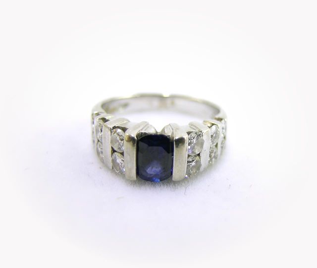 Appraisal: White Gold Sapphire and Diamond Ring with channel set design