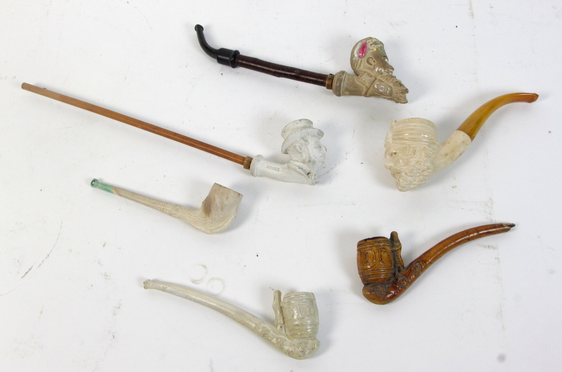 Appraisal: A Turk's head meerschaum pipe cm long and four other