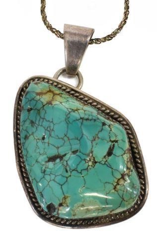 Appraisal: Native American sterling silver pendant with large bezel-set turquoise nugget