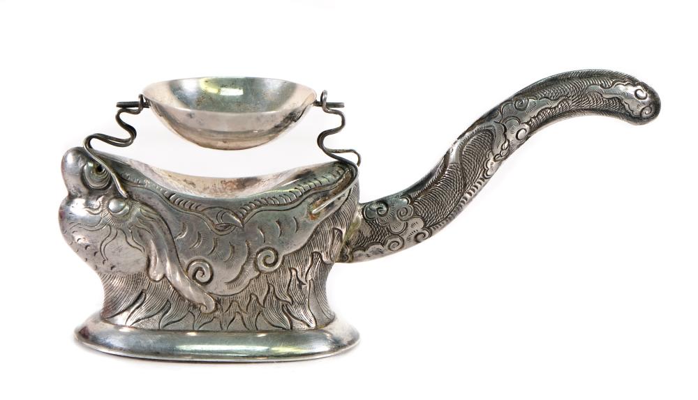 Appraisal: Vintage and unusual Vietnam figural shape tea strainer in coin