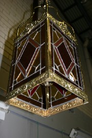 Appraisal: An amber and ruby glass brass lantern