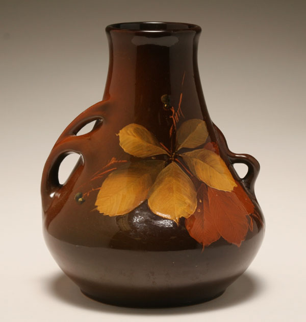 Appraisal: American brown glazed art pottery vase with stylized handles hand