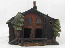 Appraisal: A carved wood Black Forest weather house with glazed and