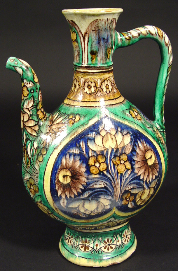 Appraisal: Middle Eastern pottery ewer profusely painted with flowers under a