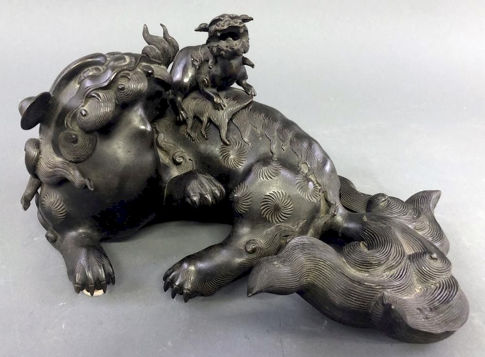 Appraisal: Japanese Bronze Recumbent Foo Dog Japanese bronze recumbent Foo dog