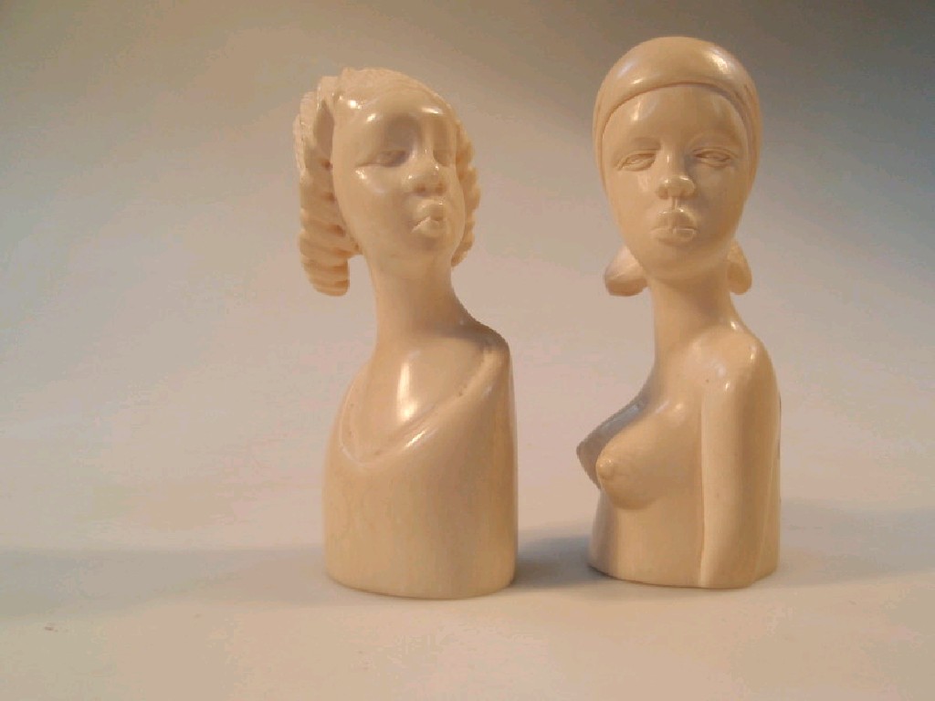 Appraisal: A pair of African ivory figural busts of women cm