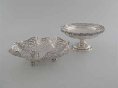 Appraisal: A pierced fruit dish on ball and claw feet London