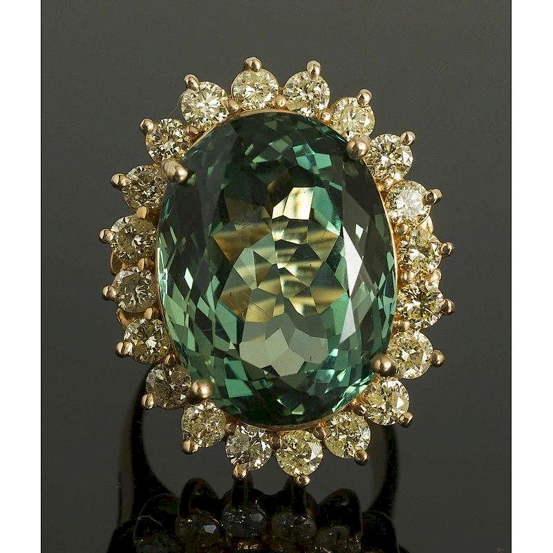 Appraisal: Teal Topaz Diamond Gold Ring k yellow gold ring containing