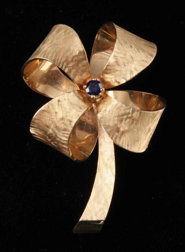 Appraisal: KY ribbon pin featuring one blue stone in shape of